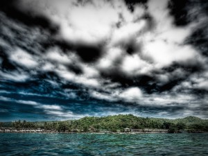 Coastal Stormy Clouds Over Town Wallpaper