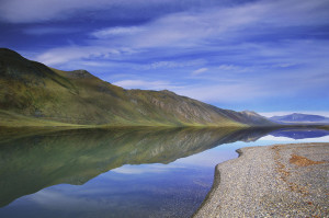 An Extremely Rare, Calm Day Brings Almost Perfect Reflections To The Surface Of Lake Peters In Alaska’s Arctic National Wildlife Refuge.